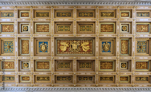 Directly above view of the ornate gilded coffered ceiling inside the Basilica of Saint Paul Outside the Walls in Rome Italy