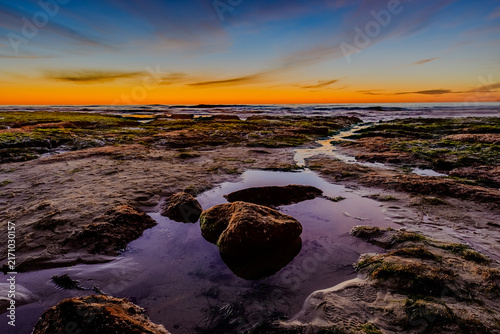 Konstfotografi Dramatic Tide Pool Reflection with Rock at Twilight, Colorful HDR Coastal Seasca