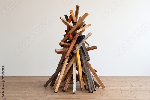Art sculpture of stacked wooden planks creativity and construction concept modern design and architectural elements