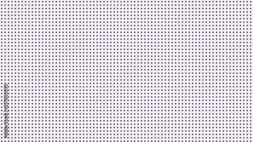 Fotografie A uniform pattern of small dark grey dots arranged in a precise grid on a plain