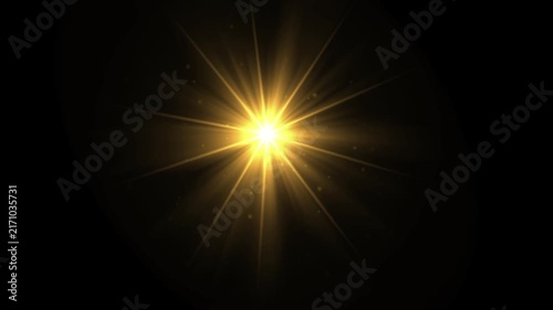 Glowing star with light rays effect on plain black background