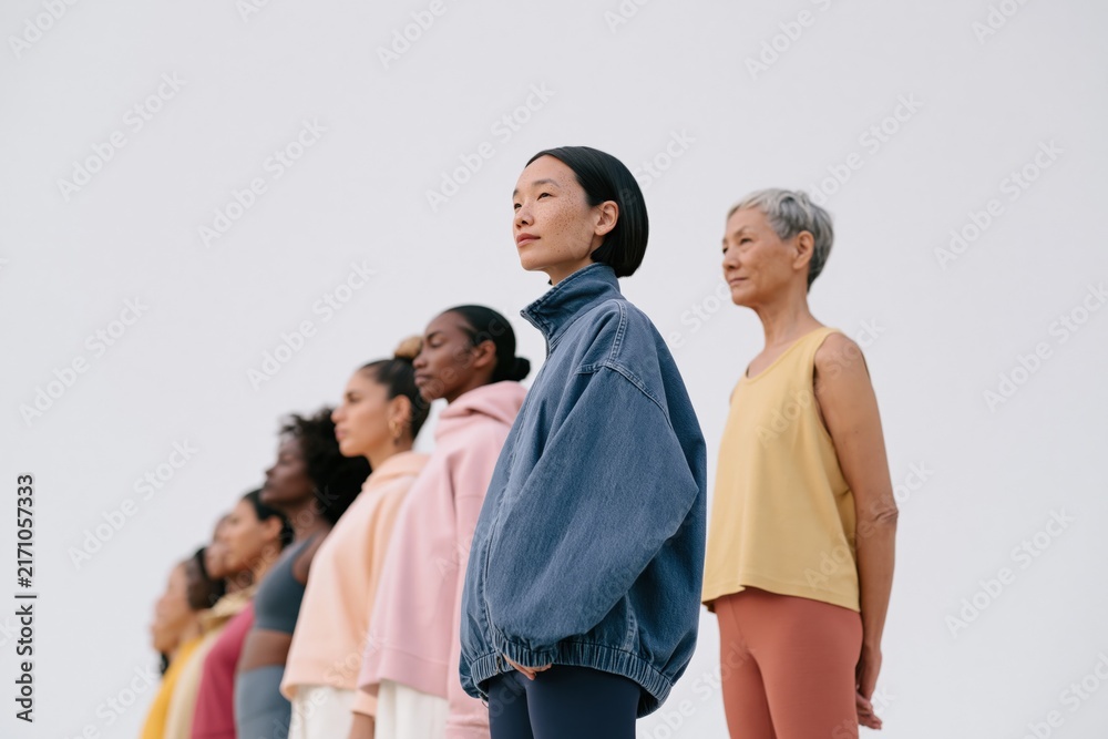 Obraz premium Diverse multigenerational women standing in line for wellness and empowerment banner background for active lifestyle design