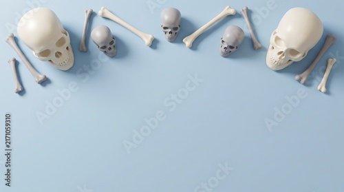 Top view of human skulls and various bones arranged in a semi circle on a light blue background
