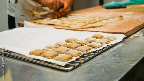 Cuadro en lienzo A chef meticulously crafts square tortelli pasta, a culinary specialty from Emil
