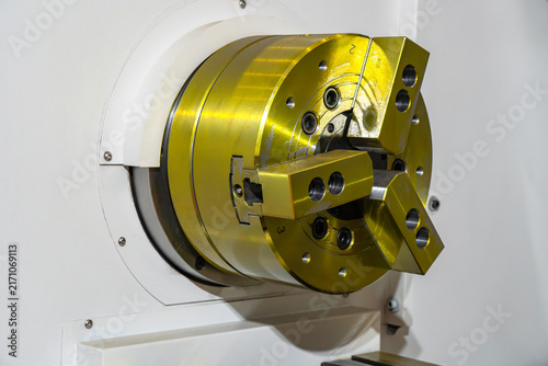 Fotografie Industrial CNC machine chuck with three adjustable jaws, detailed view of precis