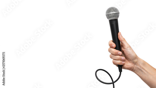 Hand holding microphone during interview with selective focus against plain background Isolated on transparent background