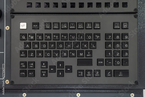 Obraz na płótnie Close-up of industrial CNC machine control panel keyboard with QWERTY layout, function keys, and numeric keypad