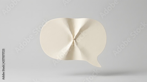 A minimalist studio shot featuring a unique pinched center paper speech form isolated against a clean light grey background surface