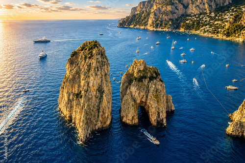 Aerial View of Faraglioni Sea Stacks and Mediterranean Coast of Capri, Italy at Golden Hour