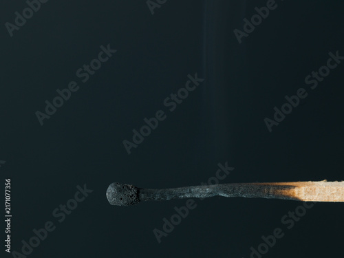 Cuadro en lienzo Macro Photograph of Extinguished Burnt Matchstick with Faint Smoke Trail