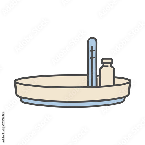 фотографія Thermometer and bottle in a tray