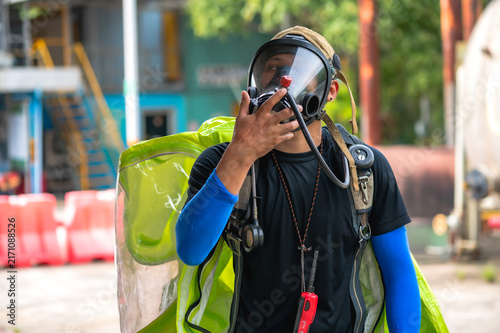 Male firefighter wearing self breathing gear ready to work on emergency respond  