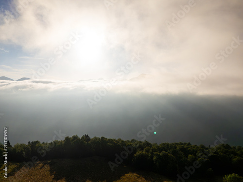 Superbagneres mountain peaks emerging from a sea of clouds