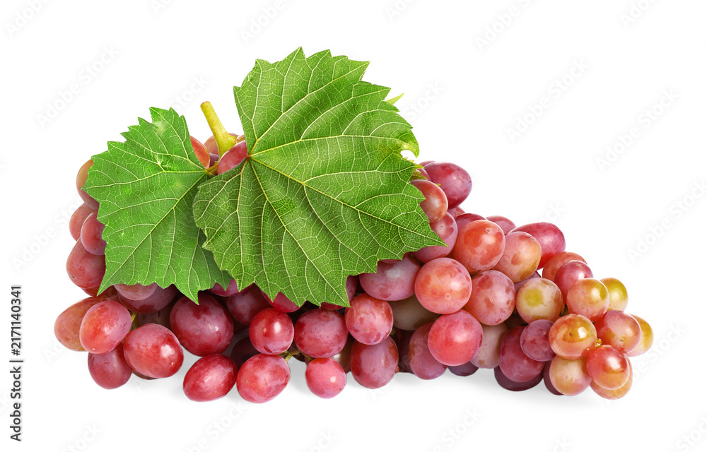 Naklejka premium Bunch of fresh ripe grapes with green leaves isolated on white
