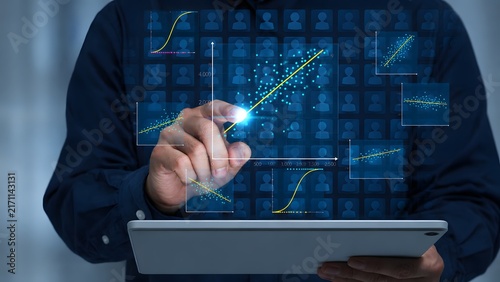 Customer data analytics. Regression analysis to identify factors influencing purchasing behavior and customer retention. Business analyst tapping graphs and marketing data on digital tablet.