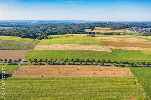 View from above of harvested grain fields and meadows in the Taunus.