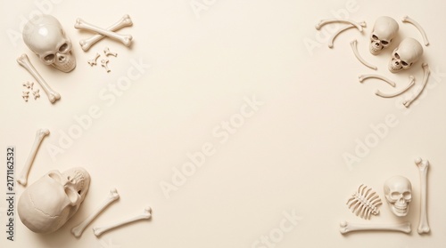 Four cherubic sculptures arranged around a blank space on a neutral background