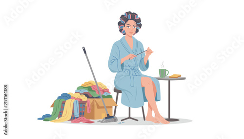 Relaxed housewife in a blue bathrobe and hair rollers files her nails instead of cleaning the pile of messy laundry.