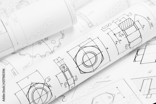 paper engineering drawings of industrial parts and mechanisms