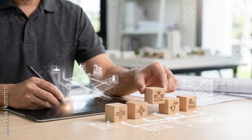 Architect placing wooden blocks for urban infrastructure planning and development project