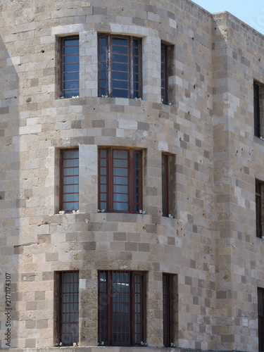 Symmetric curved brick wall architecture with dark window frames