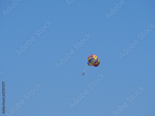 Fotografía Colorful parasail wing soaring in a clear sky with copy space