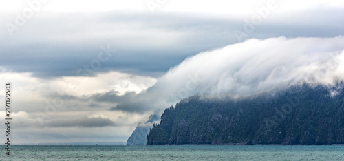 Rolling clouds surrounding island in Resurrection Bay, Kenai Fjords 