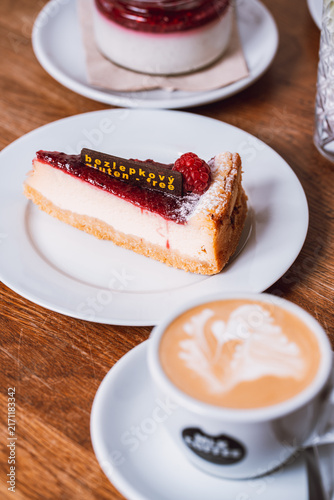 Картината върху платно Collection of delicious food, breakfast dishes, pastries, cakes, coffee, colorful drinks and desserts served in cozy café and restaurant settings, photographed in warm natural light