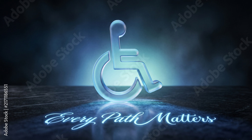 A glowing glass accessibility symbol stands on a dark surface with the text every path matters with translucent glass wheelchair symbol illuminated dark textured surface glowing light