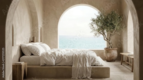 Mediterranean minimalist bedroom with arched window and sea view