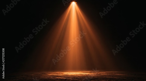 Dramatic warm spotlight illuminates a textured dark stage with atmospheric haze