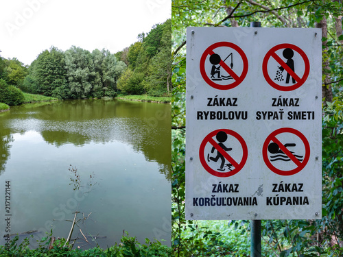 A pond with a table of prohibited activities: no fishing,
no littering, no skating, no swimming