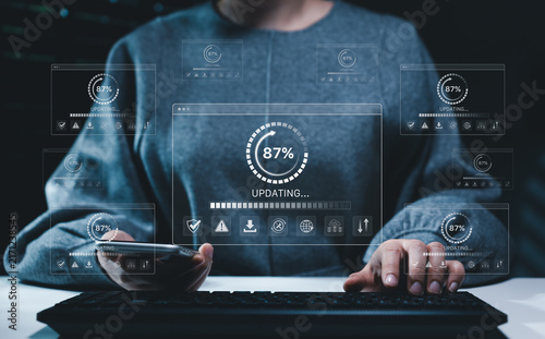 Obraz na płótnie Software update and cybersecurity concept. User operating keyboard and smartphone with progress interfaces, system maintenance, data protection, installation, network security, automation, IT workflow