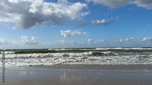The Baltic Sea in summer, the shore and waves in beautiful, sunny weather.