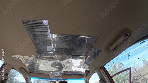 Car interior ceiling with foil patches