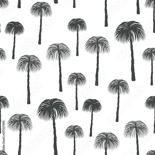 Small, varied black palm trees isolated on a white background. Monochrome seamless pattern. Vector simple flat graphic illustration, hand drawn. Texture.