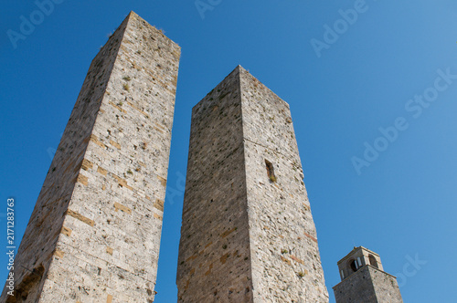 Twin Salvucci towers medieval stone skyscrapers in San Gimignano Italy