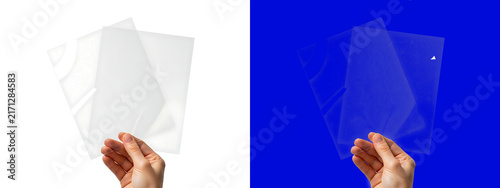 Human hand holding a transparent plastic sheet with a decorative pattern, isolated on a white background, for overlay and, texture projects isolated on a transparent background