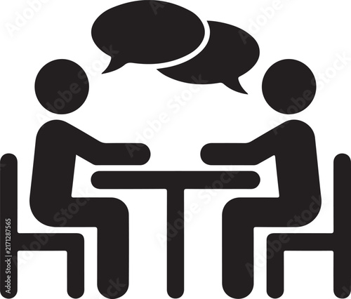 Two people talking sitting at a table icon