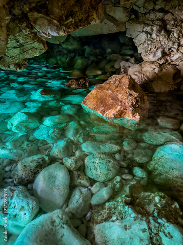 Secret Cave. The Blue Cave in Albania is a mesmerizing natural wonder known for its vibrant azure waters and stunning rock formations.
