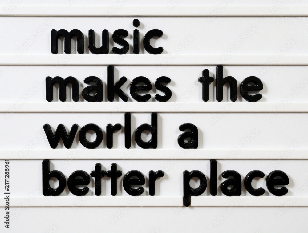 Obraz premium Black plastic letters on white board form inspirational quote. Music makes world better place text message. Creative typography design for positive message, peace concept, lifestyle banner, social