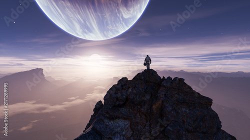 Fotografie Astronaut Standing On Alien Mountain Overlooking Giant Planet And Sunrise - Sci‑