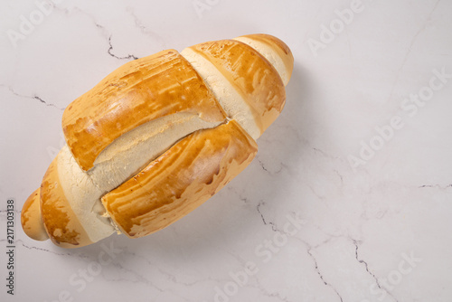 Breads,  beautiful, delicious loaves seen from above on a light, marbled surface, selective focus, top view.