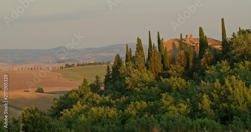 Tuscan landscape with cypress trees and villa