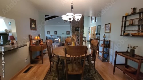 Sunny open dining area with kitchen view
