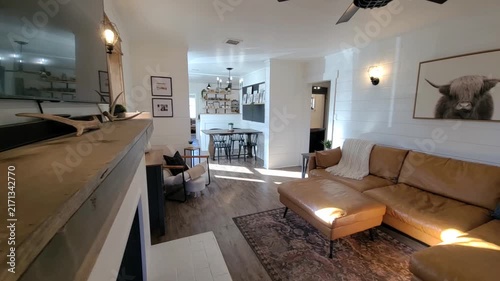 Bright open living space with neutral decor and modern kitchen
