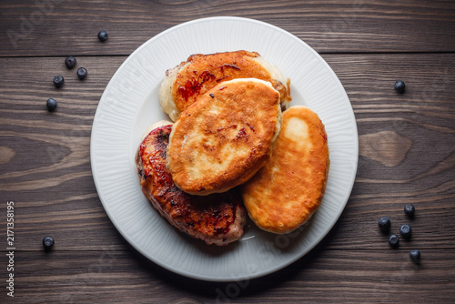 Fried common bilberry pies on plate