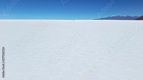 Salar de Uyuni salt flat beneath clear blue sky