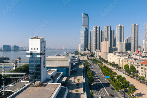 Bild auf Leinwand Aerial view of the modern Wuhan CBD skyline by the Yangtze River