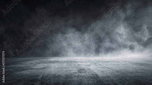 Atmospheric dark concrete floor with dense smoke, dramatic empty studio stage with fog, moody textured stone surface background isolated on White Background